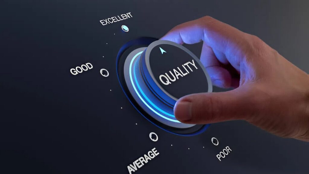 Hand adjusting a quality control dial from average to excellent, representing maintaining high standards